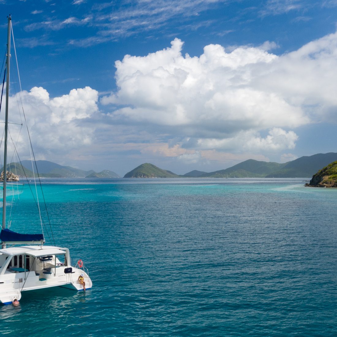 Aerial view of people relaxing on Catamaran at anchor outside of Lavango Cay, United States Virgin Islands