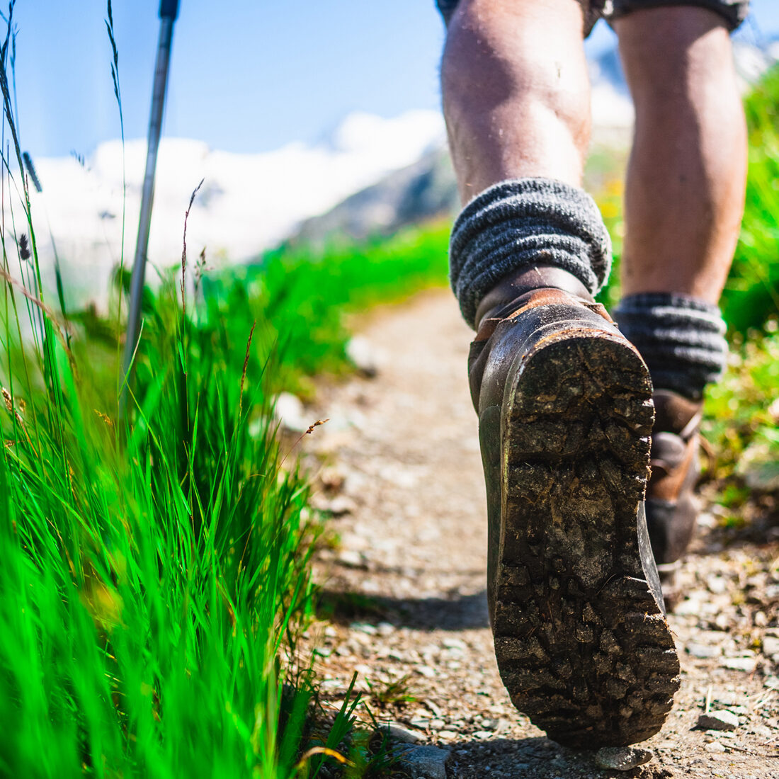 Hiker on mountain trail, Close-up.